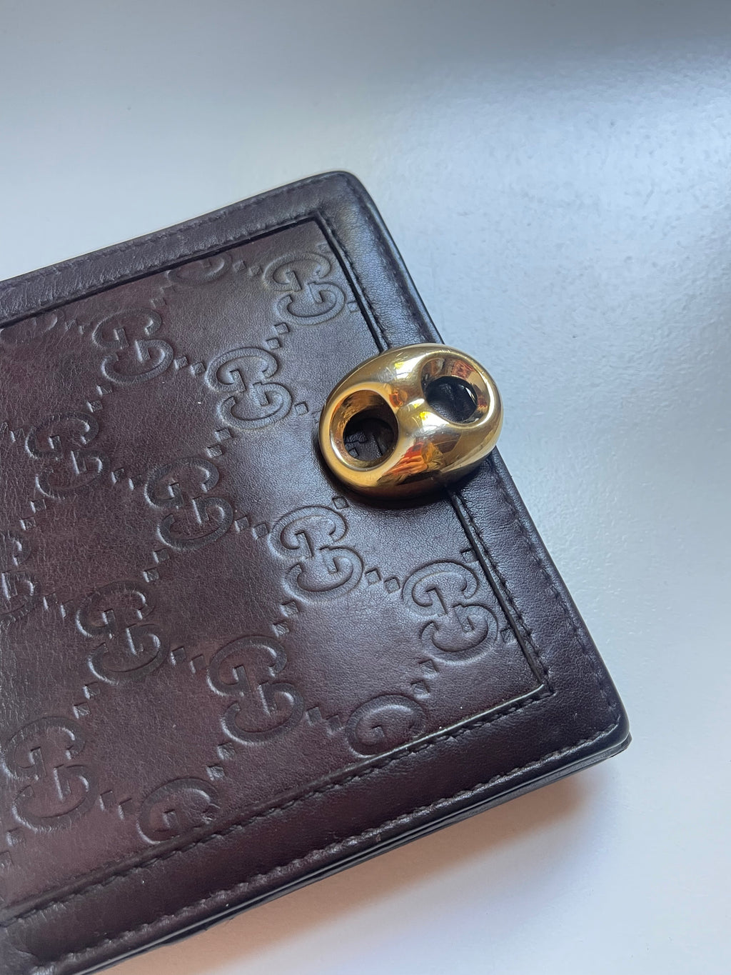 Gucci Guccissima Leather Bifold Wallet with Gold Medallion