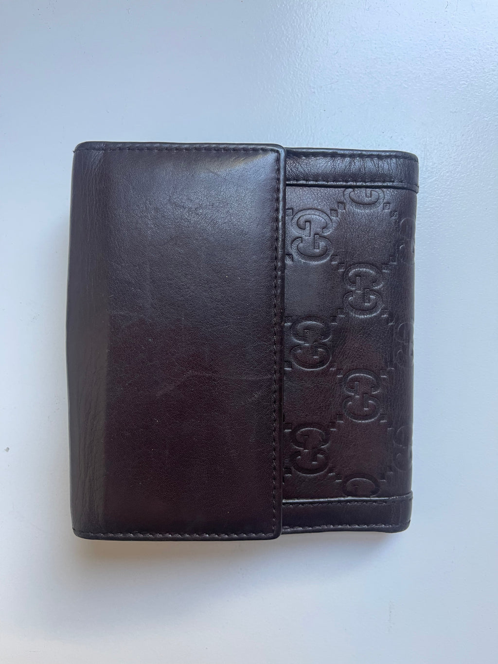 Gucci Guccissima Leather Bifold Wallet with Gold Medallion