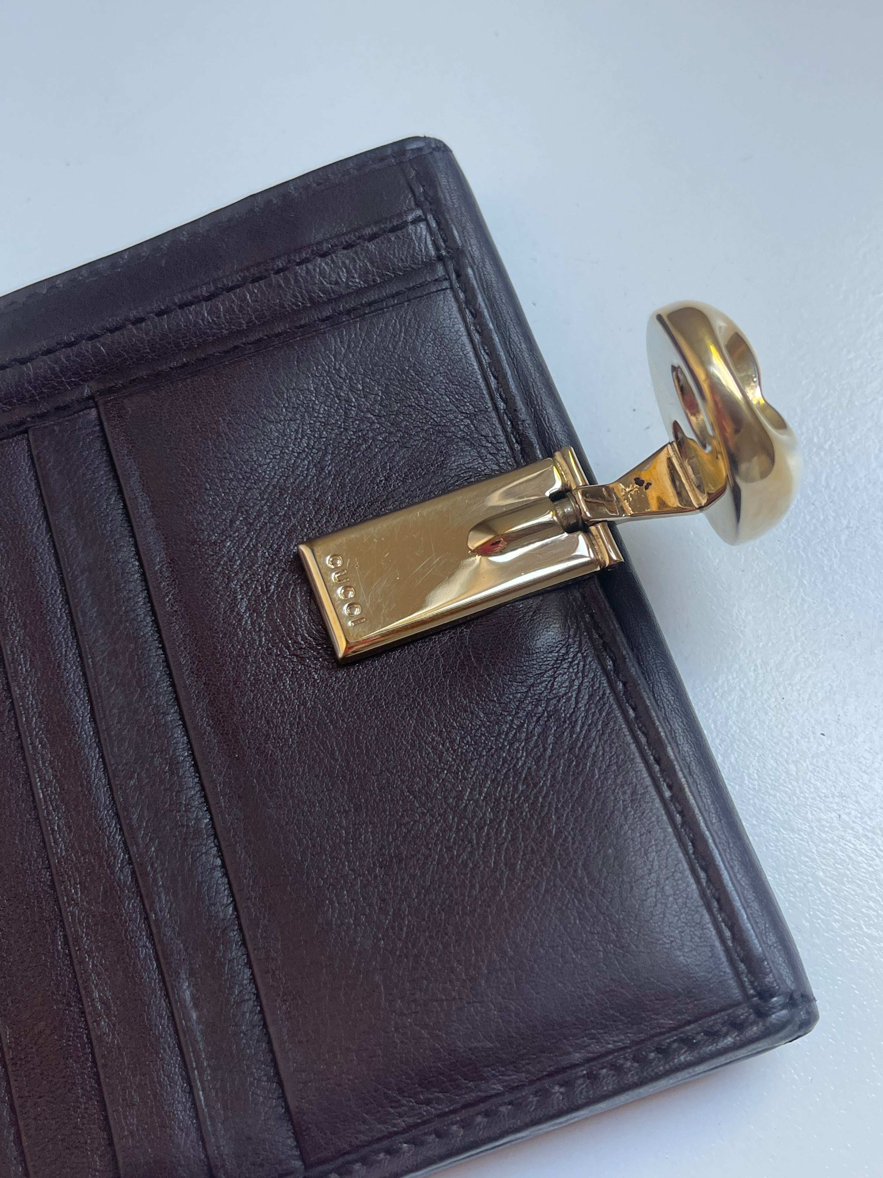Gucci Guccissima Leather Bifold Wallet with Gold Medallion